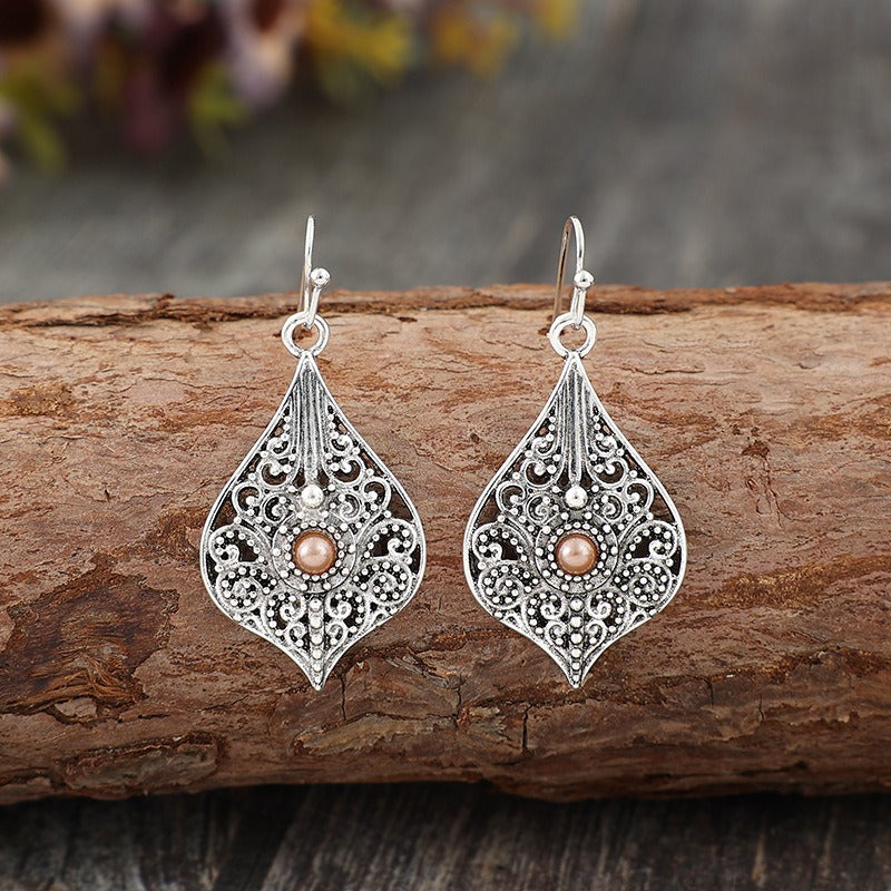 Wholesale Bohemian Retro Style Teardrop-shaped Hollow Pattern Inlaid Gem Alloy Earrings